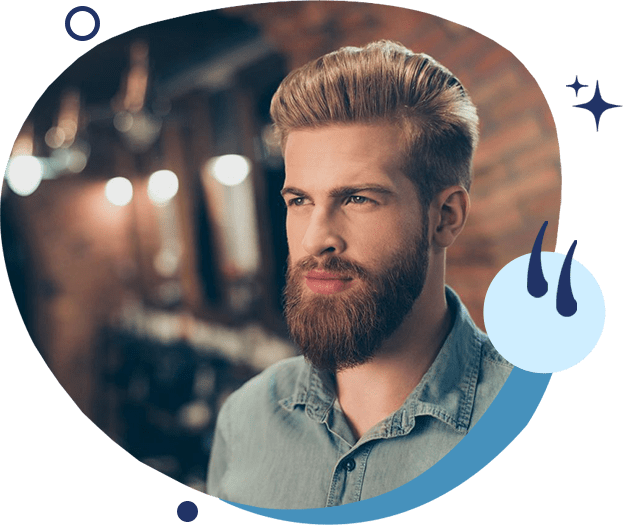 A man with a beard and mustache wearing a blue shirt